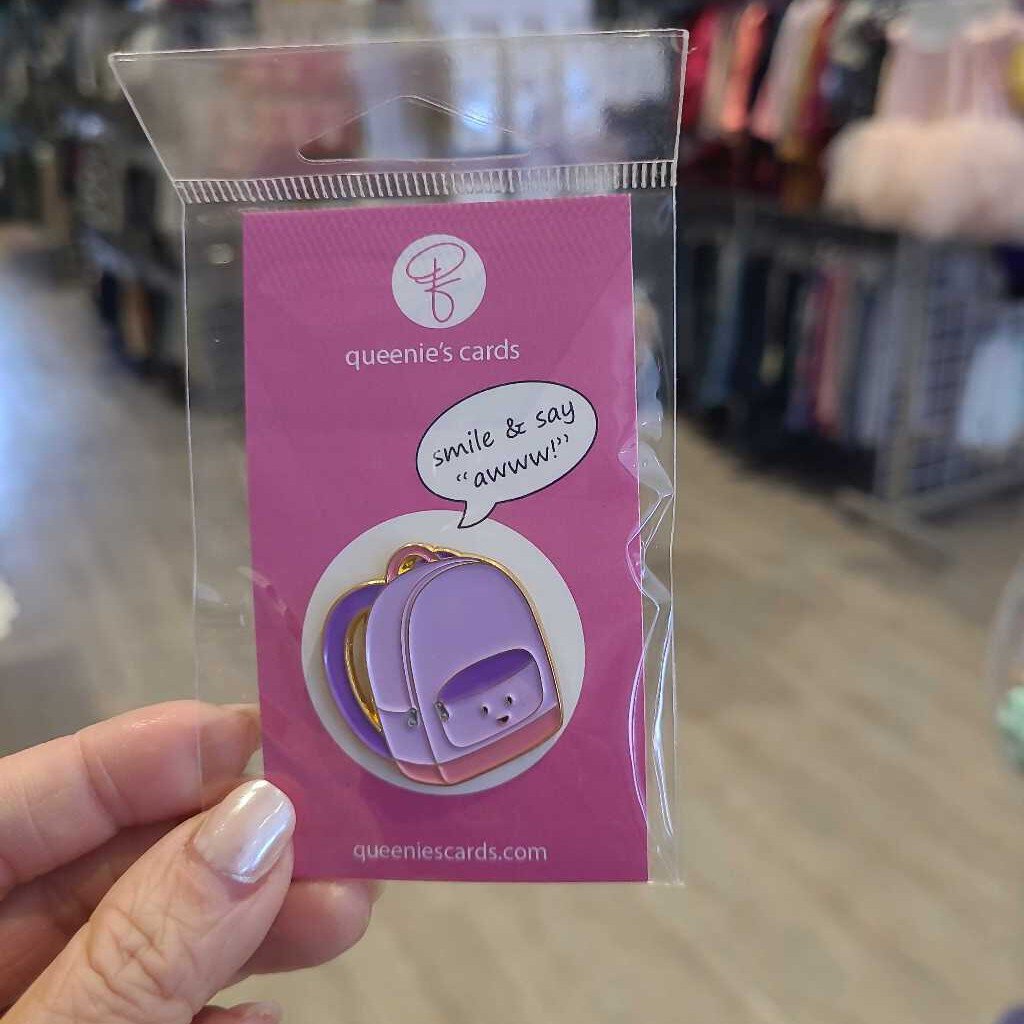 Queenies Cards purple backpack pin